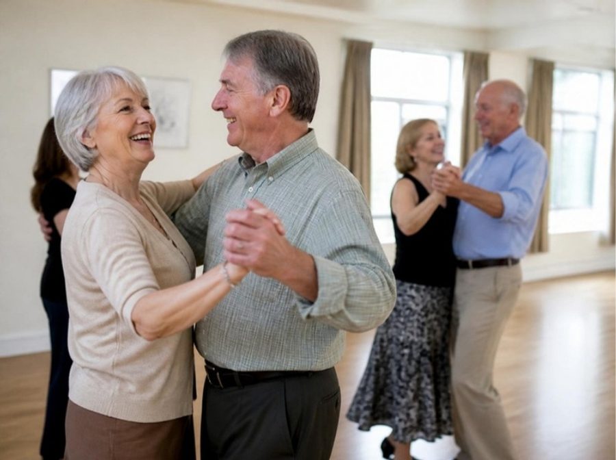 Couples in their sixties laughing together at a ballroom dance class